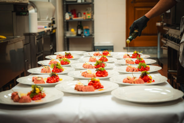 Plates of traditional Italian Fassona beef getting ready to be served